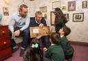 Michael Rosen and Sir Chris Hoy at a World Book Day event in 2016 (PA)