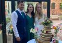 Jade, Tom, and Hannah with the precious wedding cake