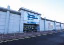 A woman tragically collapsed and died at Teesside Airport while checking in for her flight,