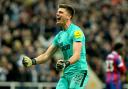 Nick Pope celebrates after his penalty-saving heroics helped Newcastle United knock Crystal Palace out of the Carabao Cup