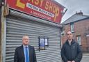 Picture attached of Shaun Trevor, of Darlington Trading Standards, and Detective Constable Jonathan Keenan, from Durham Constabulary, serving a closure notice to Easy Shop, on Victoria Road.