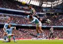 Jamaal Lascelles wins a header against Manchester City