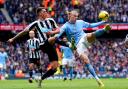 Sven Botman challenges Erling Haaland for possession during Newcastle's defeat at Manchester City last weekend