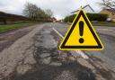 Drivers are warned to watch out for the potholes.