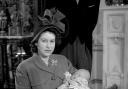 File photo dated 15/12/48 of Princess Elizabeth holding her infant son, Prince Charles, after his christening ceremony at Buckingham Palace. Photos from every year of the King's life have been compiled by the PA news agency, to celebrate Charles