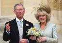 File photo dated 09/04/05 of the then Prince of Wales and the then Duchess of Cornwall leaving St Georges' Chapel, Windsor England, following a blessing of their marriage. The Queen Consort will be crowned beside her husband the King, a symbolic
