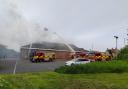 Firefighters tackle a blaze at the Iceland supermarket in Stanley.