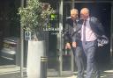 Mike Veale, right in the pink shirt, leaving the hotel in Middlesbrough where the misconduct hearing is taking place.