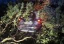 Suspected burglars crash through hedge after car chase