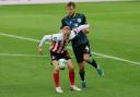 Alex Pritchard holds off his opponent during Sunderland's Carabao Cup defeat to Crewe