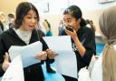 Pupils open their GCSE results at Paddington Academy in London.