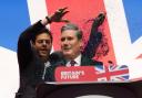A protester throws glitter over and disrupts Labour leader Sir Keir Starmer