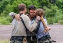 Gareth Gates, centre, is embraced by celebrity recruits Matt Hancock and Danielle Lloyd after being declared the winner of Celebrity SAS: Who Dares Wins