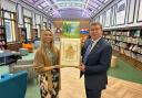 Peter Gibson MP presents the work of art to Darlington Library manager Suzy Hill