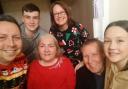 Carol Tate, 73, with her family during her last Christmas