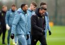Callum Wilson shares a joke with Newcastle assistant Jason Tindall at training this morning