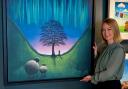 Artist Lucy Pittaway with the canvas of her painting of the Sycamore Gap tree