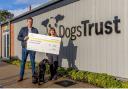 Michael Luke from Tees Valley International Film Festival hands £1,000 to Bethany Scrafton at Darlington’s Dogs Trust Credit: SARAH CALDECOTT