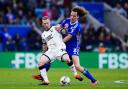 Lewis O'Brien holds off Wout Faes during the win over Leicester City