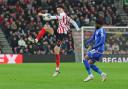 Jenson Seelt plays the ball forward during Sunderland's defeat to Leicester City