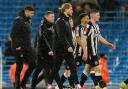 Eddie Howe walks off with his Newcastle United players in the wake of yesterday's 2-0 defeat at Manchester City