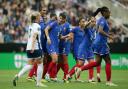 Elisa de Almeida (centre) leads the celebrations after scoring France's opening goal in their 2-1 win over England