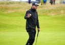 Dan Brown reacts after putting on the 15th green in his third round at The Open