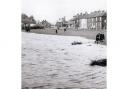 RISING DAMP: Schoolboys watch the river rise at Neasham on November 3, 1960. The Fox and Hounds is in the background. This picture appears in the fantastic new Echo Memories book, The Road to Rockliffe