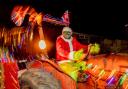 Santa Claus, or possibly The Christmas Grinch, at the forefront of the festive Tractor Run in Woodland, County Durham