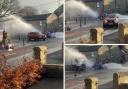 The burst water pipe has caused water to shoot into the road, hitting oncoming vehicles
