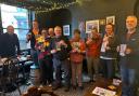 CAMRA members and Ripon BID manager Lilla Bathurst with the new Ripon Real Ale Guide