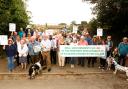 Members of Dishforth Residents' Group show their opposition to the housing plan.