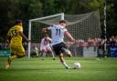Dylan Stephenson sends over a cross in Darlington's defeat to King's Lynn