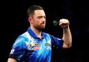 Luke Humphries defeated Dave Chisnall to reach the second round of the World Grand Prix in Leicester (Bradley Collyer/PA)