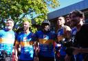 Sir Kevin Sinfield, third right, was joined by Micah Richards, third left, as he completed day four of his final ultra marathon challenge (Annabel Lee Ellis/PA)