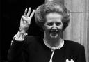 Prime Minister Margaret Thatcher giving a three-fingered salute outside 10 Downing Street as she begins her third successive term of office