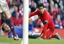 Luis Suarez, right, and Chelsea's Branislav Ivanovic on the ground after Suarez bit Ivanovic during the Barclays Premier League match at Anfield, Liverpool, in April last year