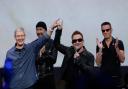 09/09/2014 File Photo of Apple CEO Tim Cook, left, smiling next to U2 members, The Edge, Bono, and Larry Mullen Jr. during an announcement of new products in Cupertino, Calif.   See PA Feature INTERNET Internet Column. Picture credit should read: AP