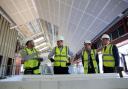 David Cameron speaks to apprentices at an office construction site during a 'Cameron Direct' event in Leeds