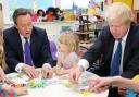 David Cameron and London mayor Boris Johnson explain their childcare plans to three-year-old Stephanie