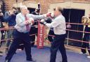 Lord Prescott (left) takes on TV reporter Michael Crick in the boxing ring at Redcar Amateur Boxing Club