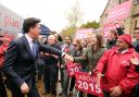 Labour Party leader Ed Miliband greets supporters as he arrives for a General Election campaign stop at the Muni Theatre in Colne, Lancashire