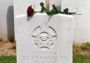 A  single red rose on Mynarski's headstone at the cemetery in Meharicourt, France