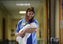 Midwife Elaine Dallas poses for a photograph with baby Sadie O'Donnell. Picture: Jamie Simpson / Herald & Times