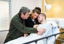 The family wait expectantly as first Aidan Connor (Shayne Ward) is wheeled down the operating theatre