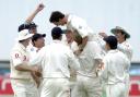 Cricket - Gary Pratt is mobbed by his teammates during his Ashes run-out of Ricky Ponting.