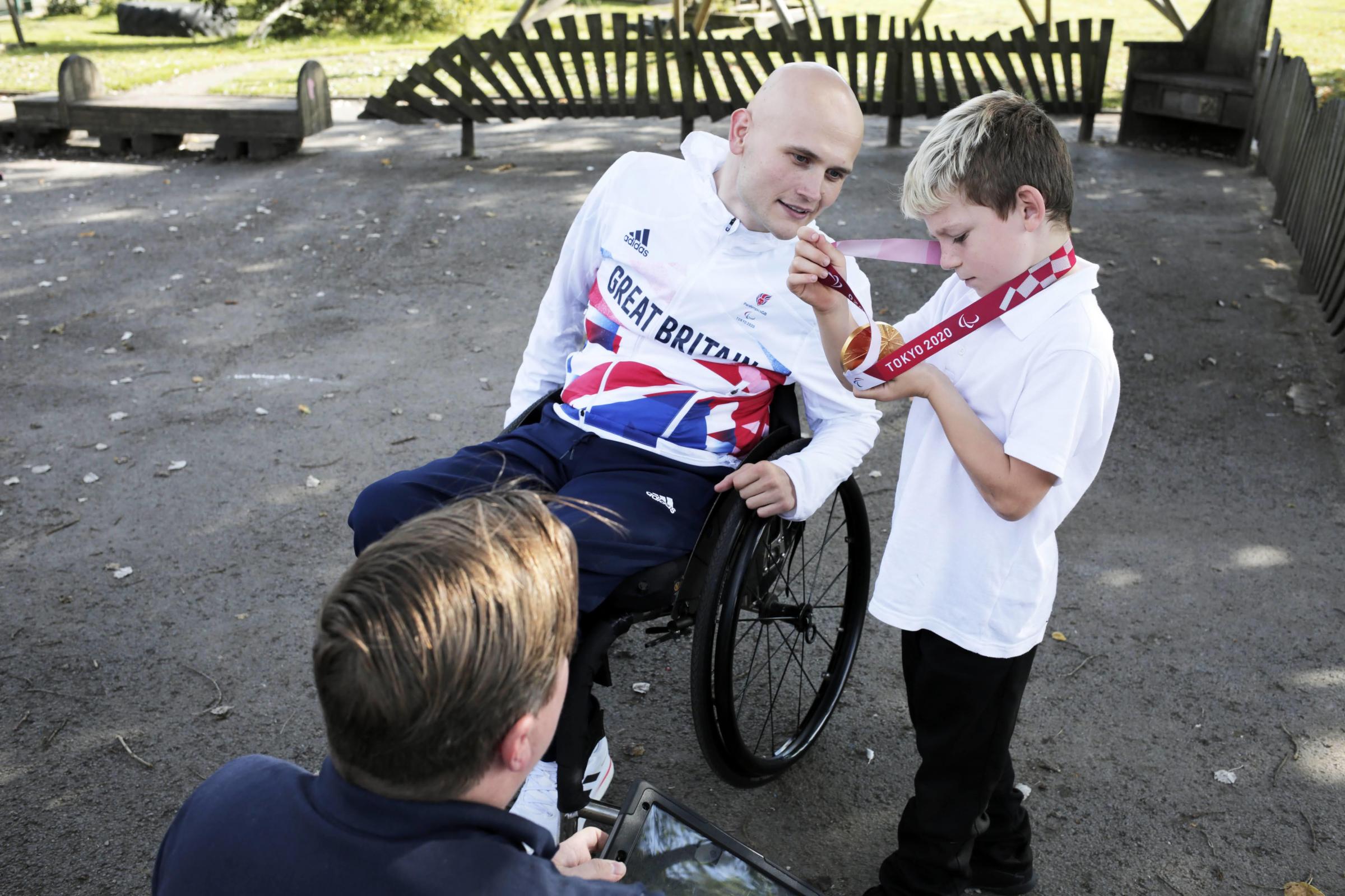Gold medal winning paralympian Jack Smith with year 4 pupil Jayden Hind at Tanfield Lea Community Primary School, near Stanley. Photograph: Stuart Boulton.Gold medal winning paralympian Jack Smith at Tanfield Lea Community Primary School, near Stanley