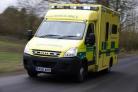 Woman taken to hospital after falling off wall
