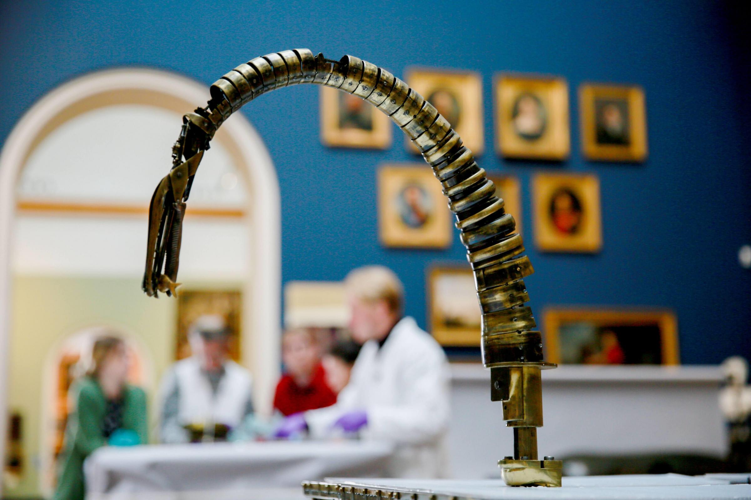 Conservators and curators studying the Bowes most iconic object 