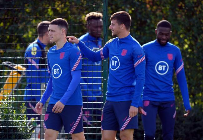 Mason Mount (centre) ahead of England's training session in London yesterday